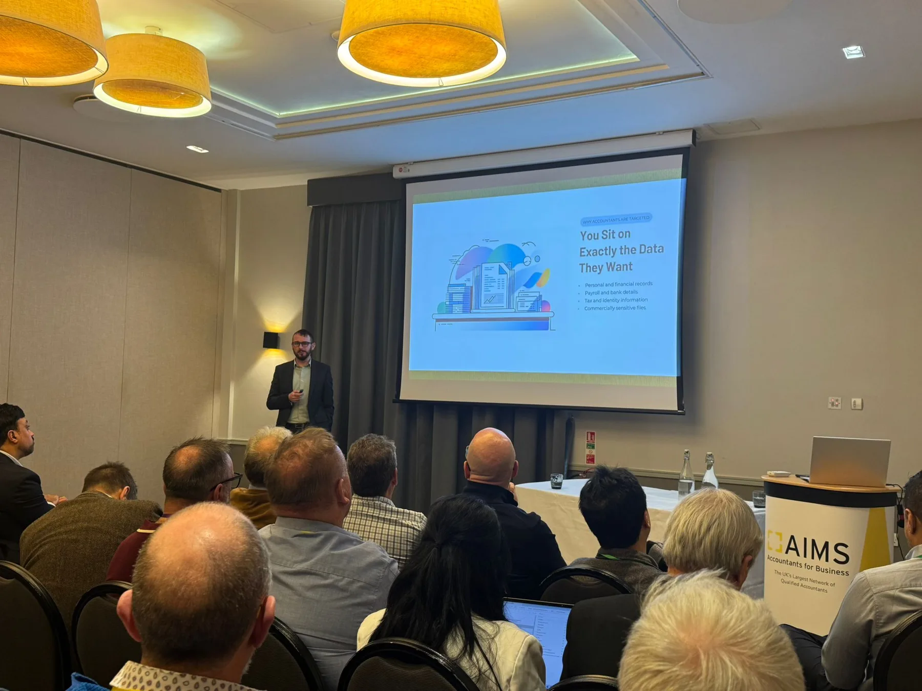 Tom presenting to an AIMS conference audience